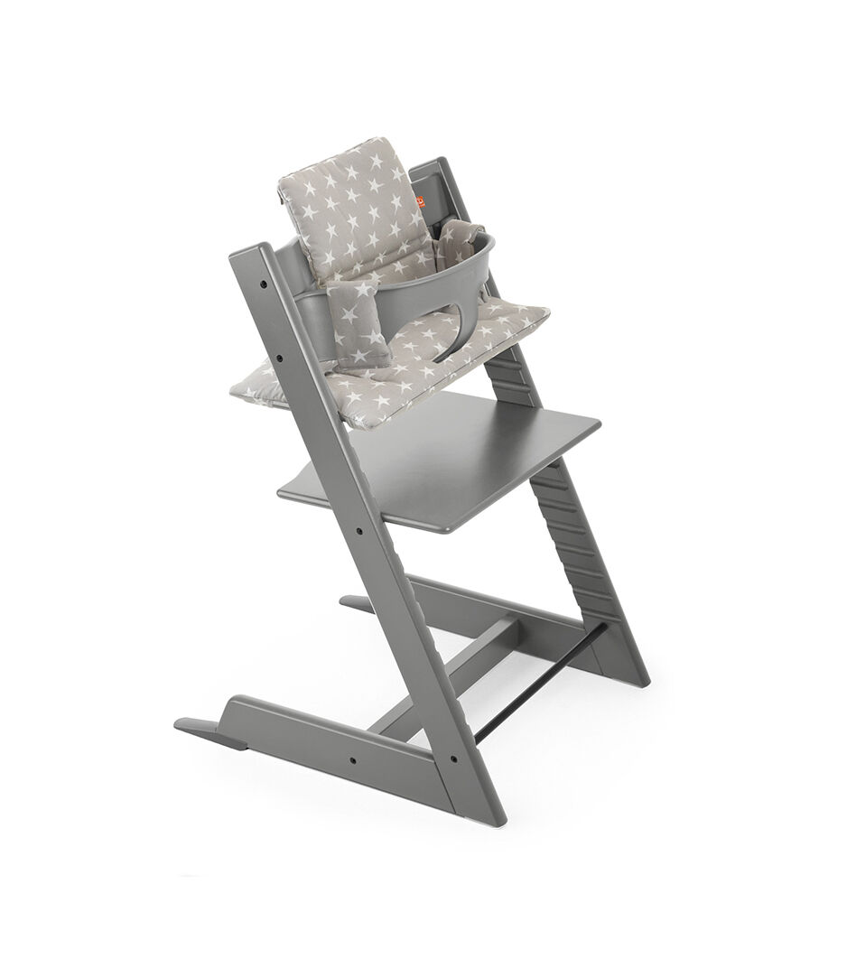 Tripp Trapp® Storm Grey with Baby Set and Grey Star Cushion.